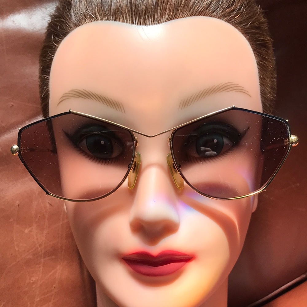 Paloma Picasso sunglass frames in gold and black. Add your own lenses! Prescript